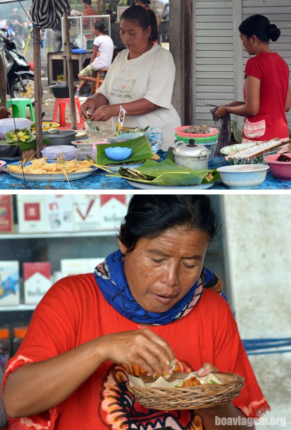 Feirante e mulher fazendo refeição